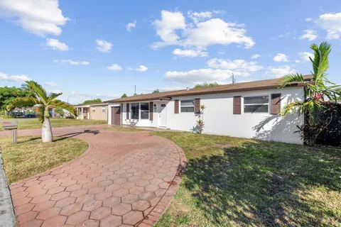 a house view with a backyard space
