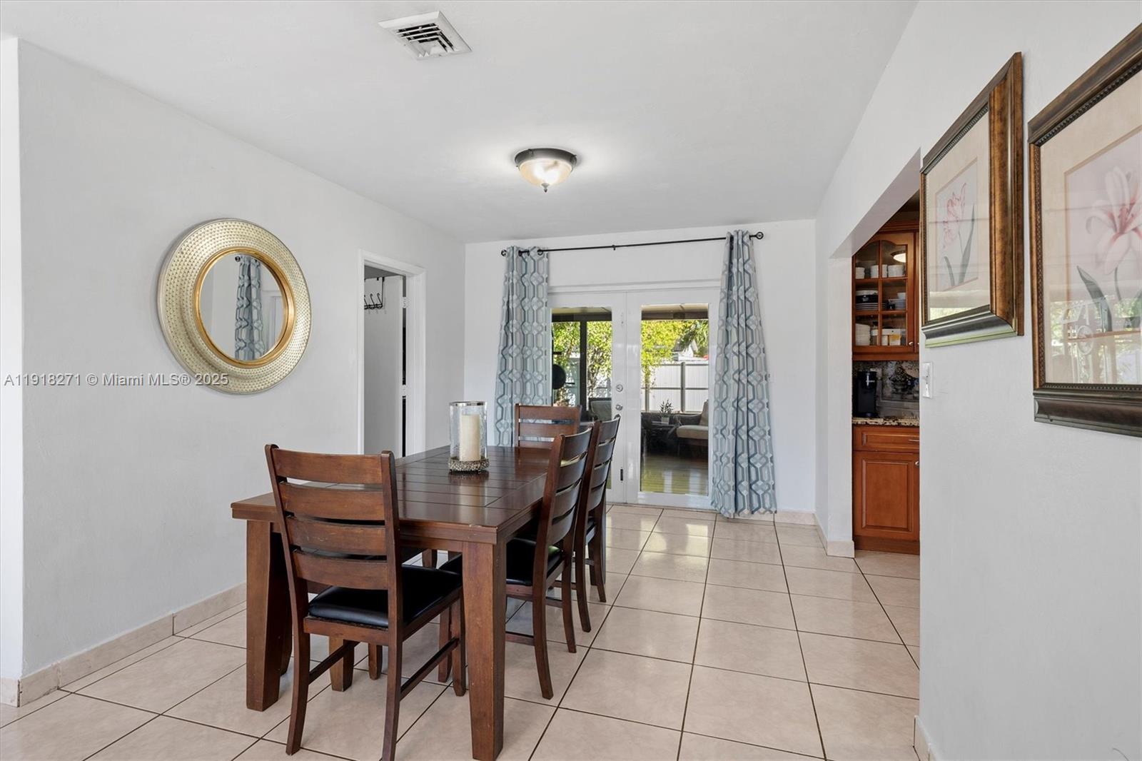 9411 Southwest 30th Terrace Miami, FL 33165 - Photo 4 of 42 a dining room with furniture and a window