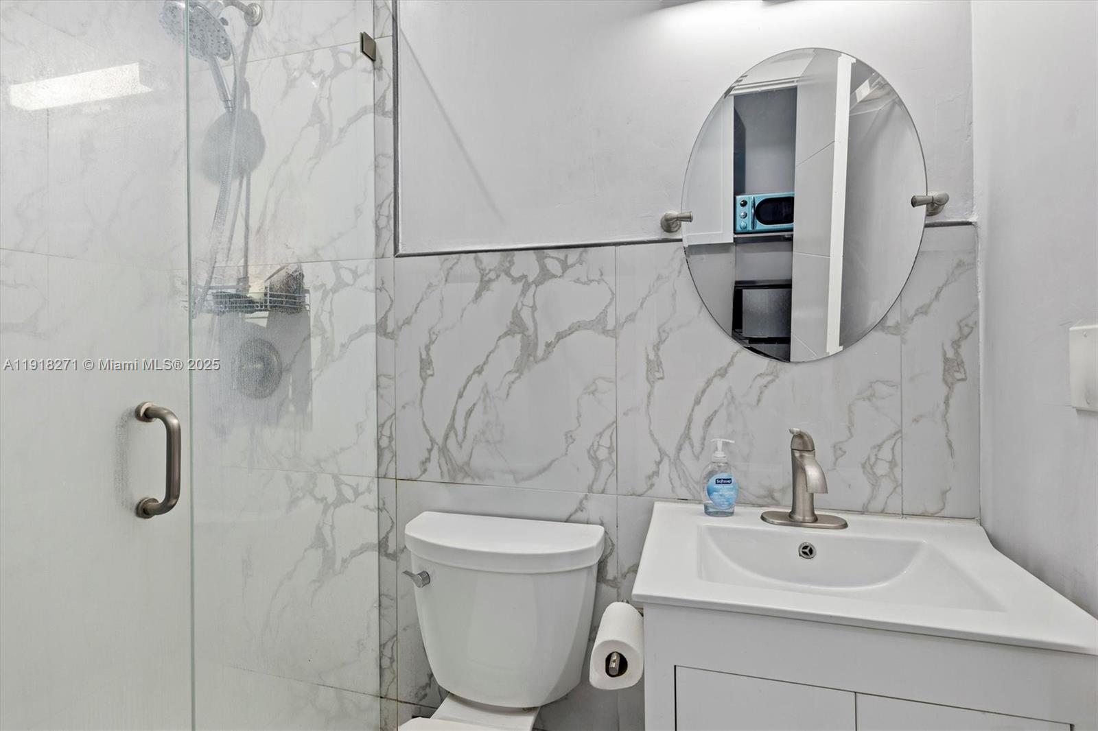 9411 Southwest 30th Terrace Miami, FL 33165 - Photo 42 of 42 a bathroom with a toilet sink and shower