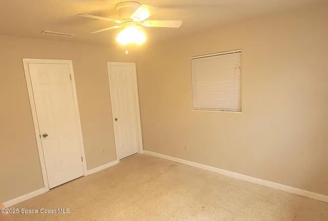 a view of a small space with a fan