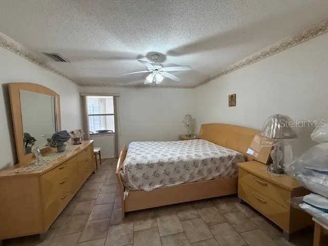 a bed room with a bed and a chandelier