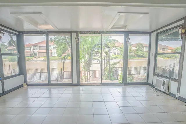 a view of an empty room with a large window