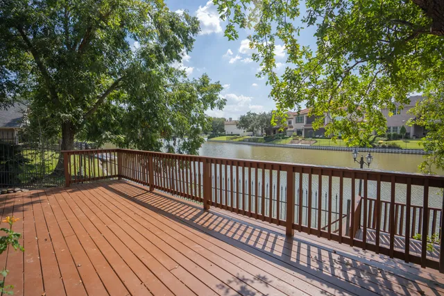a view of balcony with wooden floor