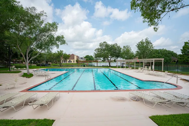 a view of a swimming pool with an outdoor space
