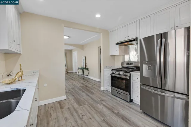 a view of bathroom with a toilet a sink and a mirror