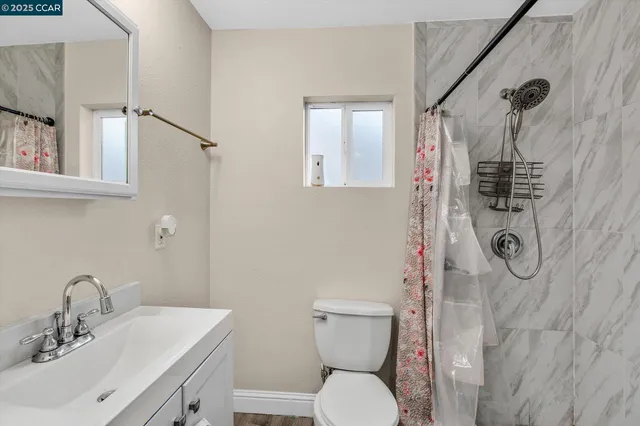 a bathroom with a sink toilet and vanity