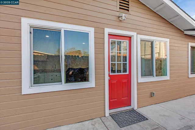 a kitchen with stainless steel appliances a refrigerator and a stove top oven