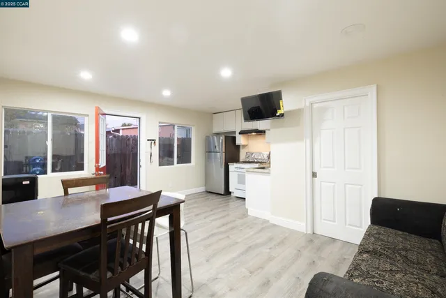 a living room with furniture and a table