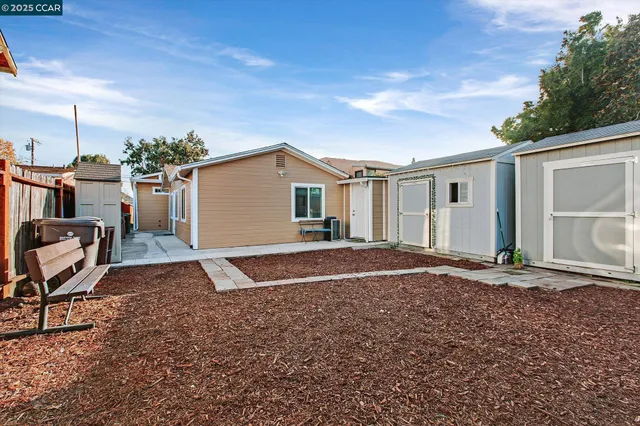 a view of a backyard of the house