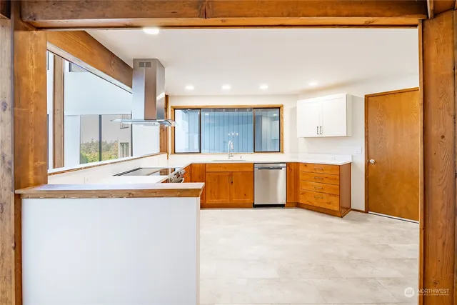 a kitchen with a sink and a refrigerator