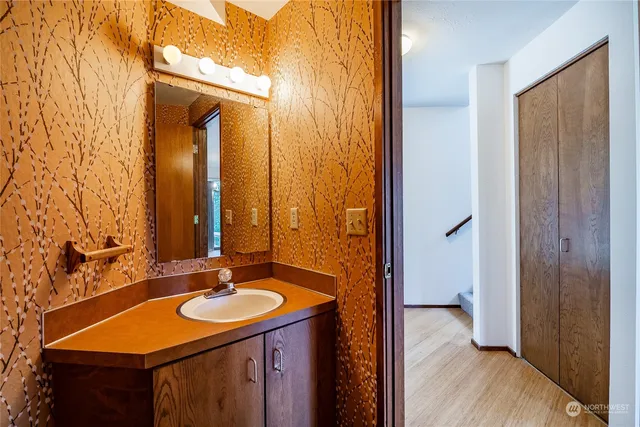 a bathroom with a sink double vanity and a mirror