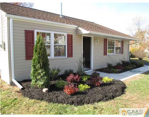 18 Colton Road Edison, NJ 08817 - Photo 1 of 10 a front view of a house with a yard