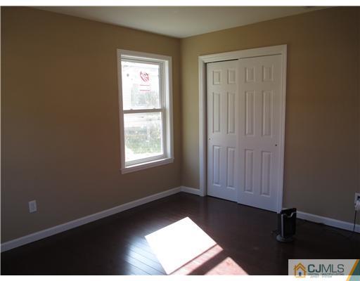 18 Colton Road Edison, NJ 08817 - Photo 5 of 10 a view of an empty room with a window