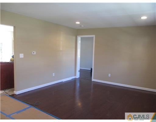 18 Colton Road Edison, NJ 08817 - Photo 9 of 10 an empty room with wooden floor