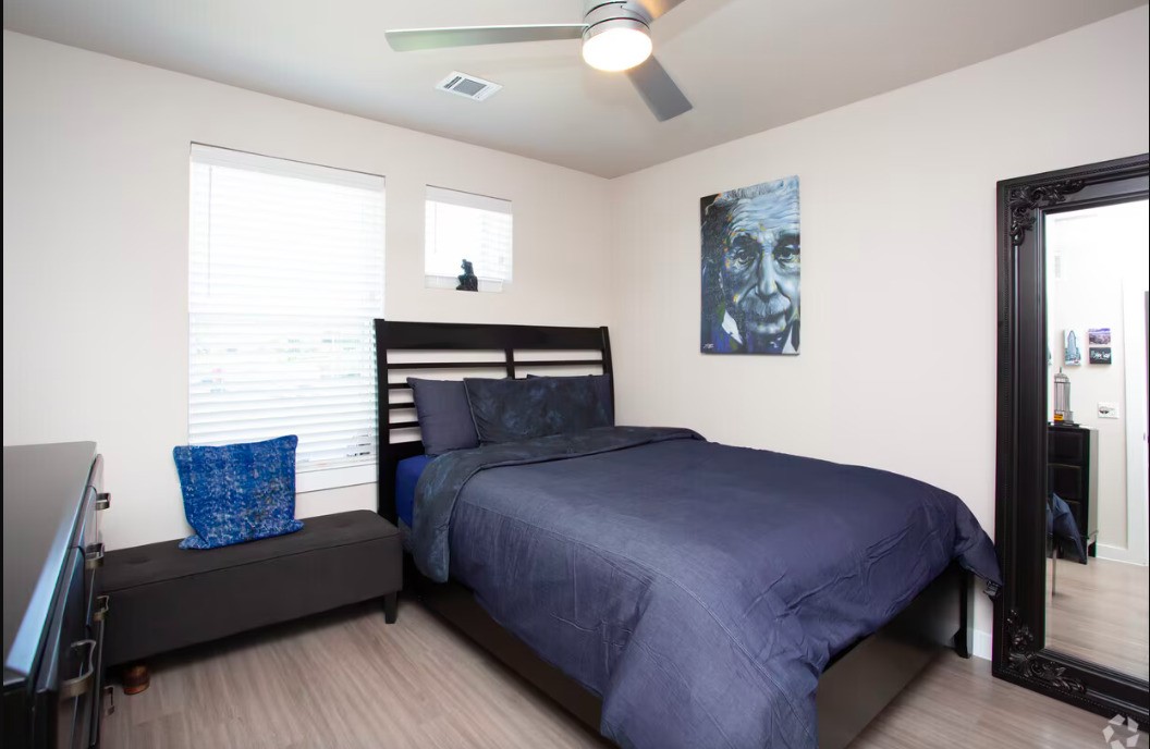 1800 South I- 35 Service Road Austin, TX 78748 - Photo 10 of 21 a bedroom with a bed couch and window