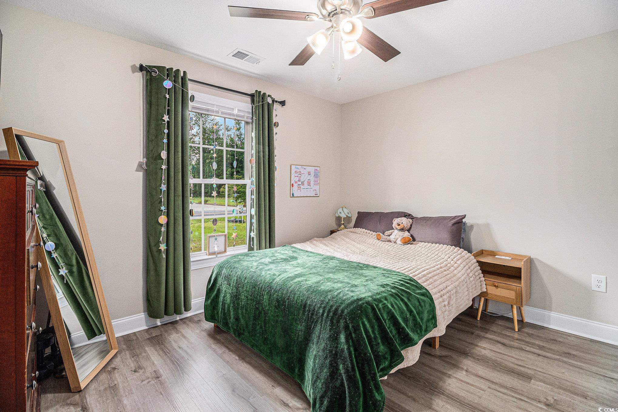 2521 Wise Road Conway, SC 29526 - Photo 14 of 20 Bedroom with wood finished floors, baseboards, and ceiling fan