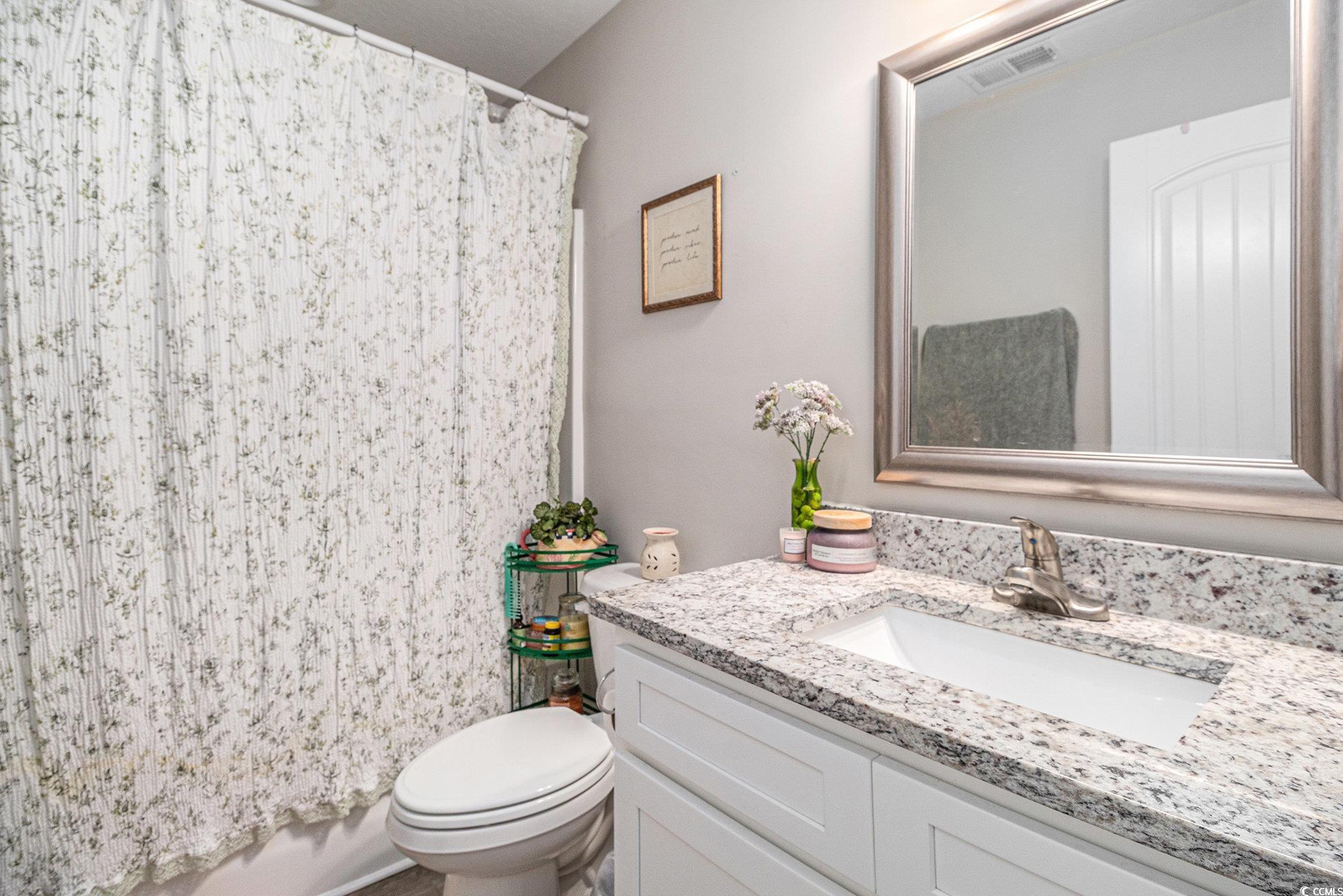 2521 Wise Road Conway, SC 29526 - Photo 15 of 20 Bathroom featuring toilet, vanity, and a shower with shower curtain