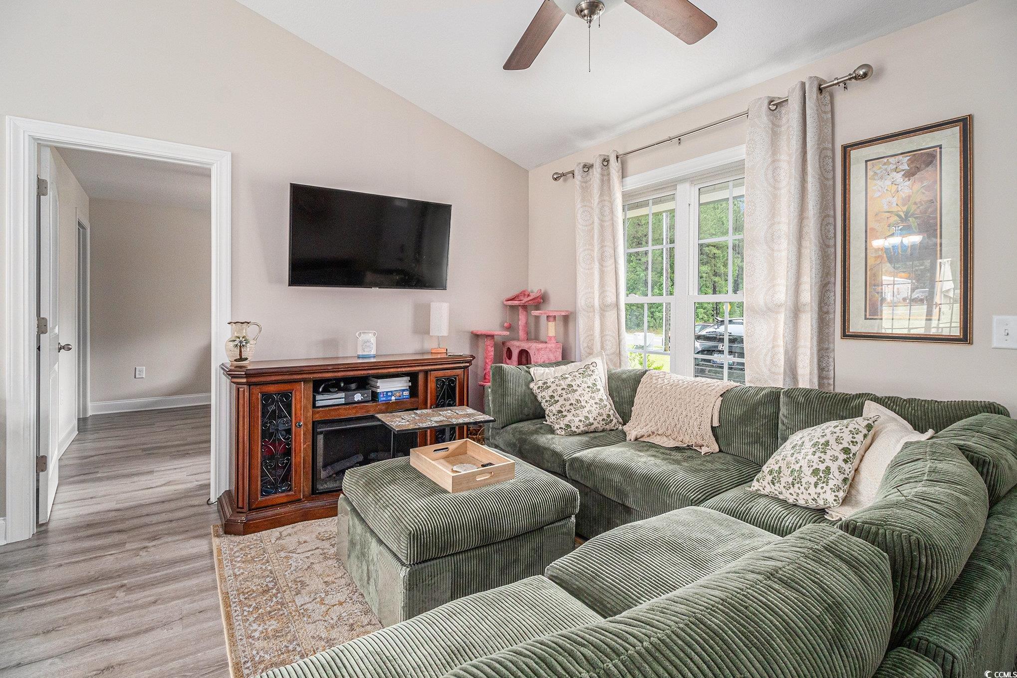 2521 Wise Road Conway, SC 29526 - Photo 5 of 20 Living room featuring wood finished floors, vaulted ceiling, a ceiling fan, and baseboards