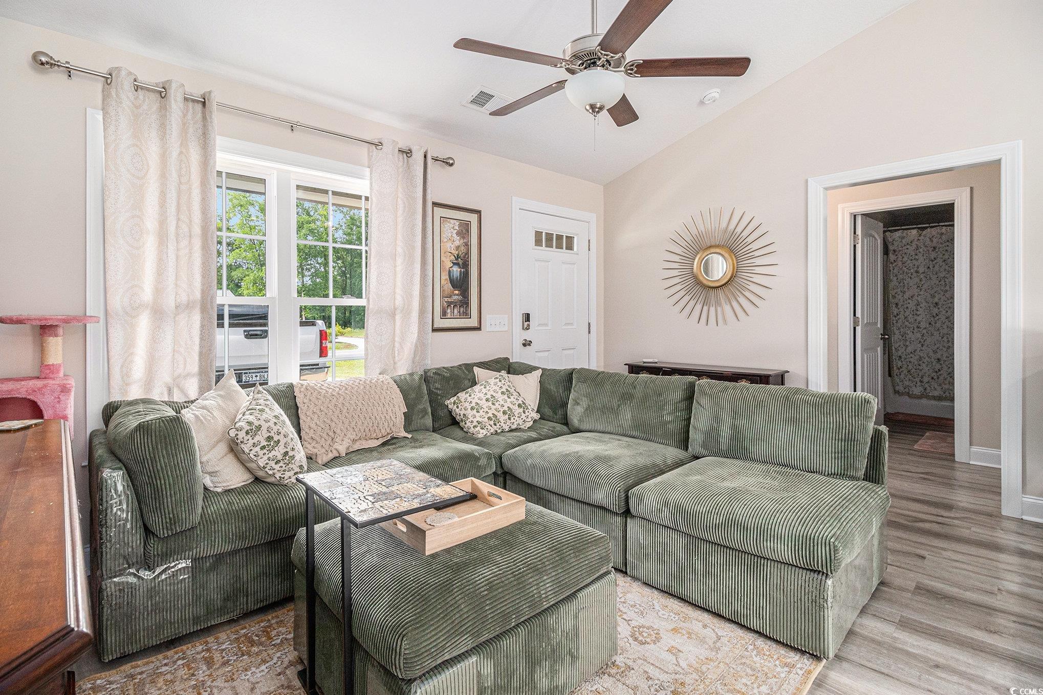 2521 Wise Road Conway, SC 29526 - Photo 6 of 20 Living area with a ceiling fan, lofted ceiling, wood finished floors, and baseboards