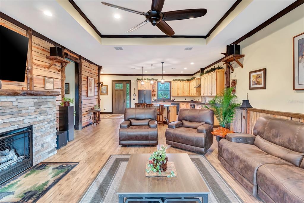 7330 Crabgrass Road St. Cloud, FL 34773 - Photo 15 of 60 a living room with furniture fireplace and a flat screen tv