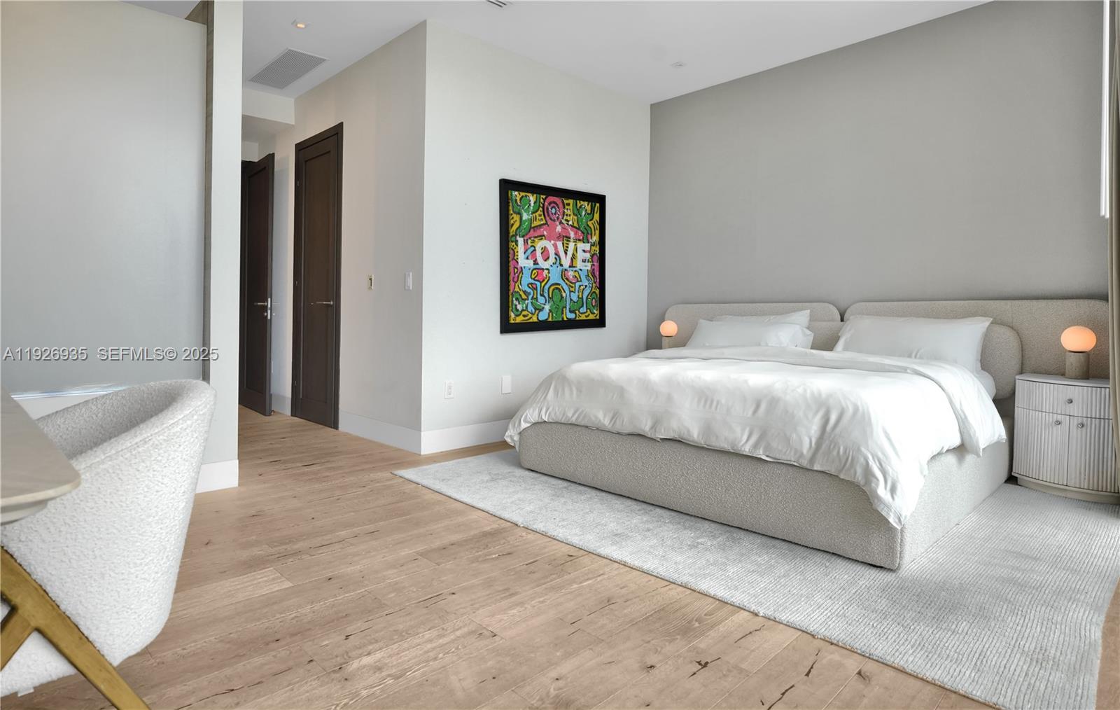 5501 Pine Tree Drive Miami Beach, FL 33140 - Photo 51 of 60 a bedroom with a bed and a couch