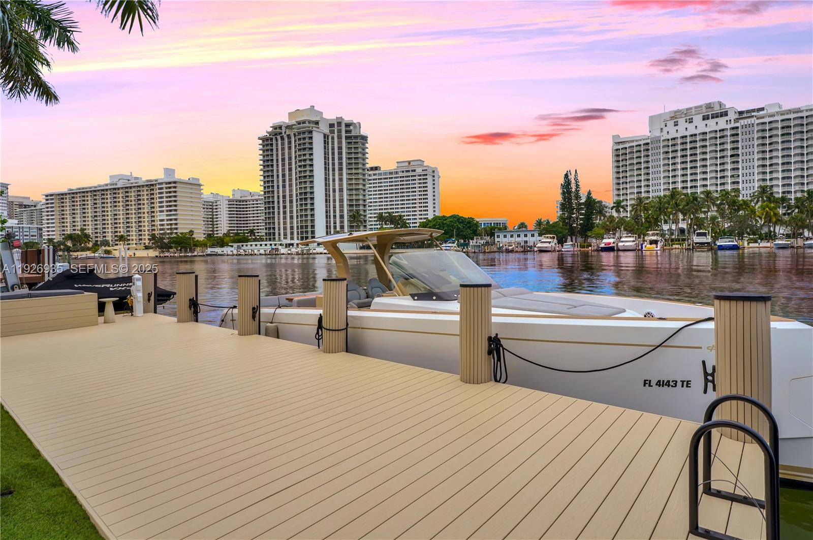 5501 Pine Tree Drive Miami Beach, FL 33140 - Photo 59 of 60 a view of roof deck with a barbeque and wooden floor