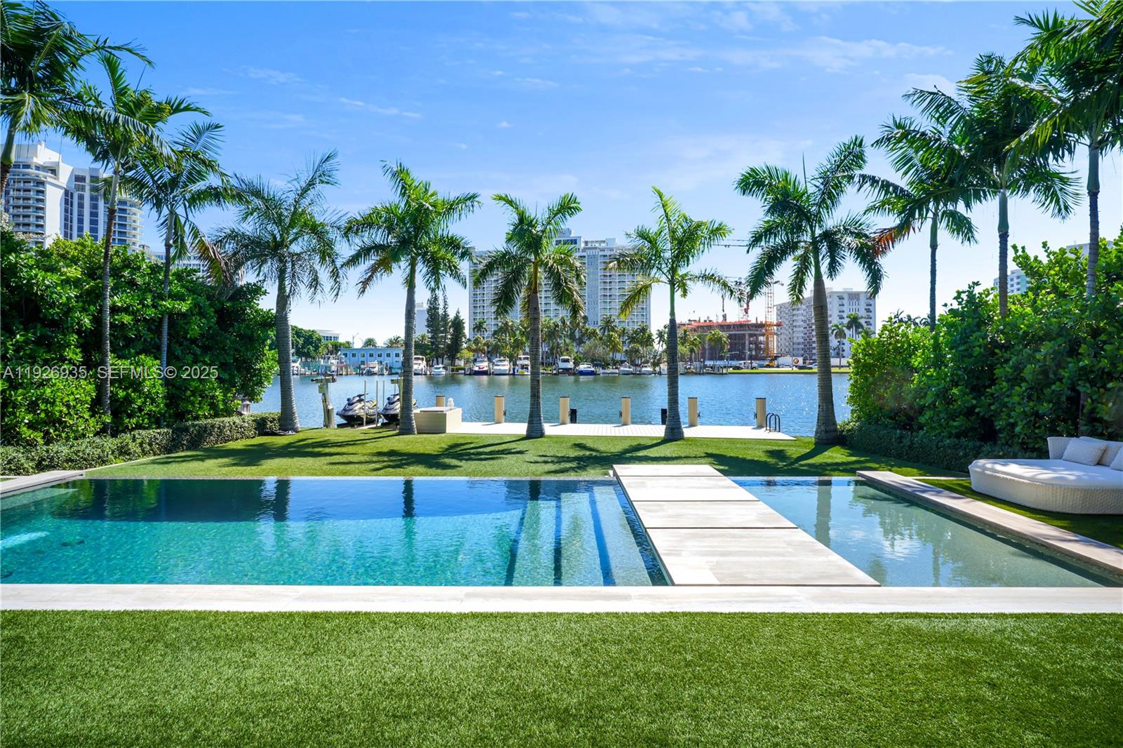 5501 Pine Tree Drive Miami Beach, FL 33140 - Photo 7 of 60 a view of swimming pool with a yard