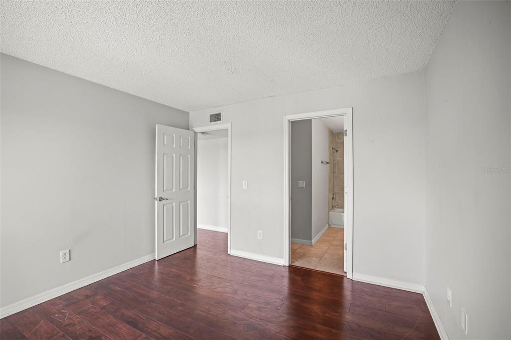 455 Alt 19, Unit 175 Palm Harbor, FL 34683 - Photo 22 of 35 a view of an empty room with wooden floor