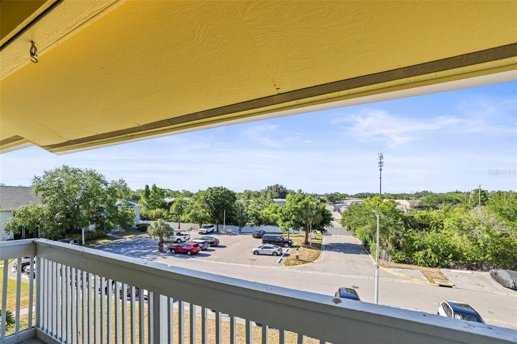 455 Alt 19, Unit 175 Palm Harbor, FL 34683 - Photo 26 of 35 a view of a balcony and car parked