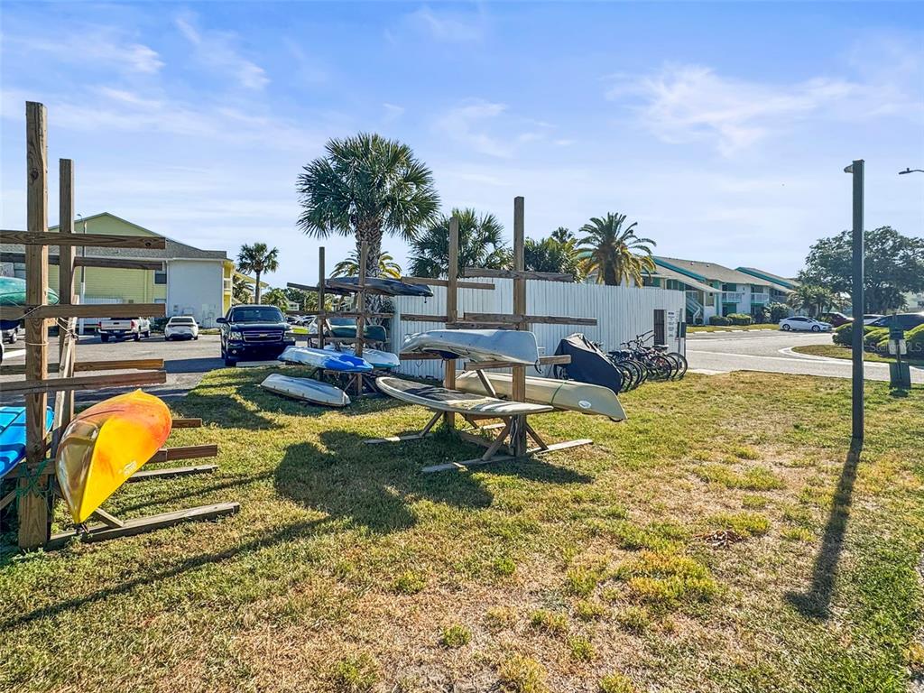 455 Alt 19, Unit 175 Palm Harbor, FL 34683 - Photo 30 of 35 a swimming pool with outdoor seating and yard