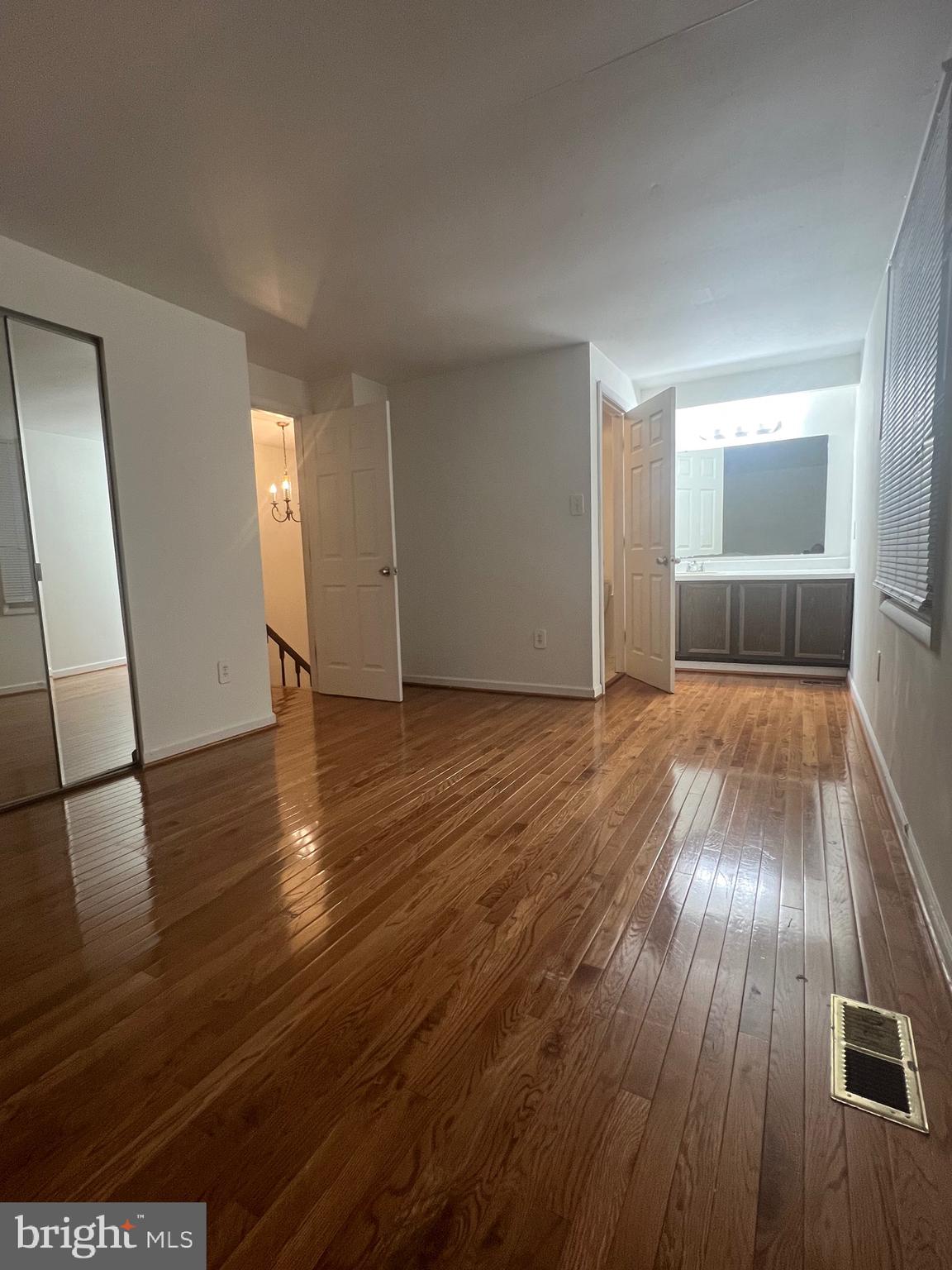 18804 Creeper Lane Gaithersburg, MD 20879 - Photo 12 of 20 a view of empty room with wooden floor