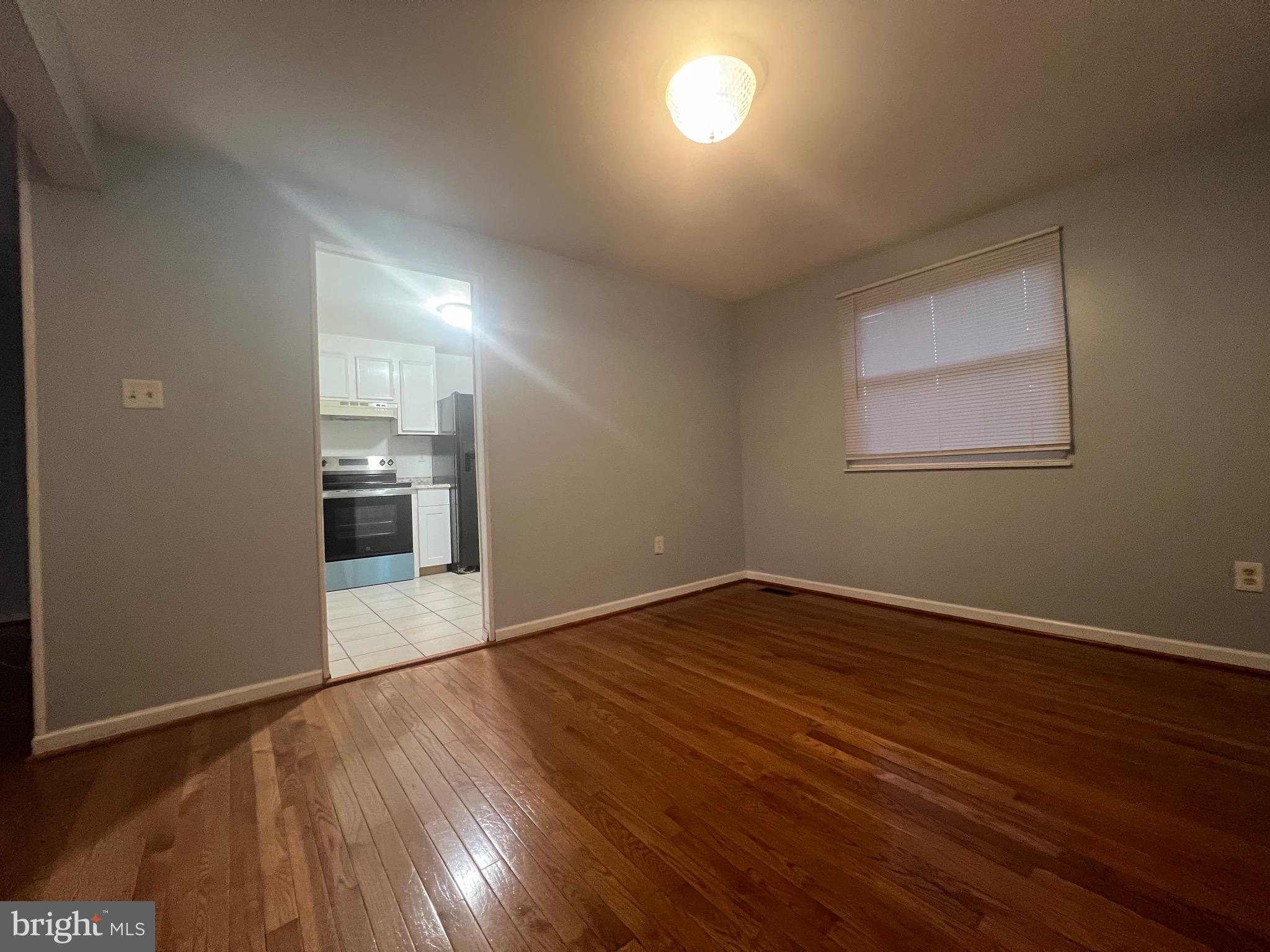 18804 Creeper Lane Gaithersburg, MD 20879 - Photo 15 of 20 a view of empty room with wooden floor