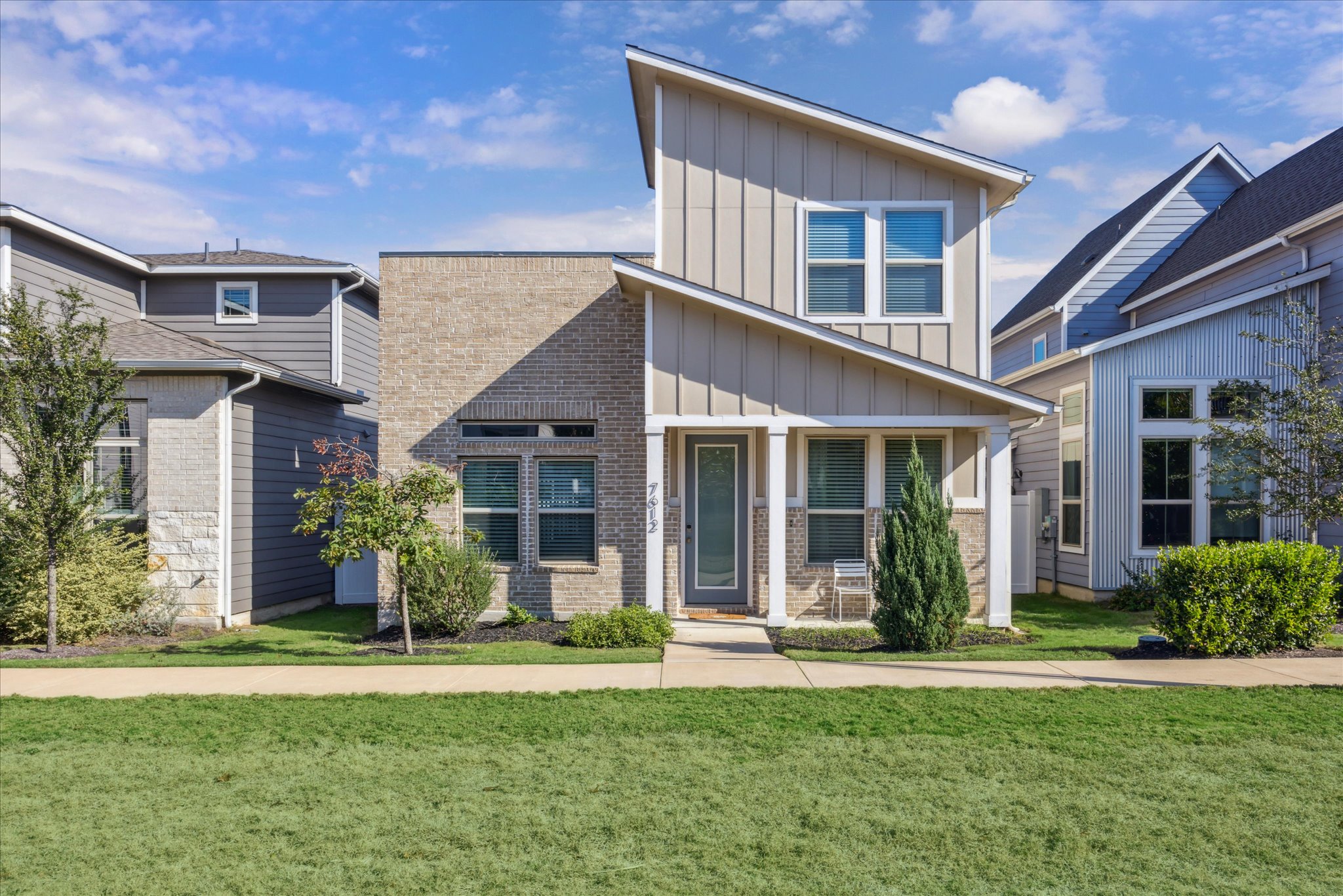 7612 Mandela Bend Austin, TX 78744 - Photo 1 of 1 front view of a house with a yard