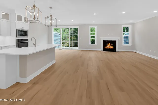 a view of a kitchen with furniture and a fireplace