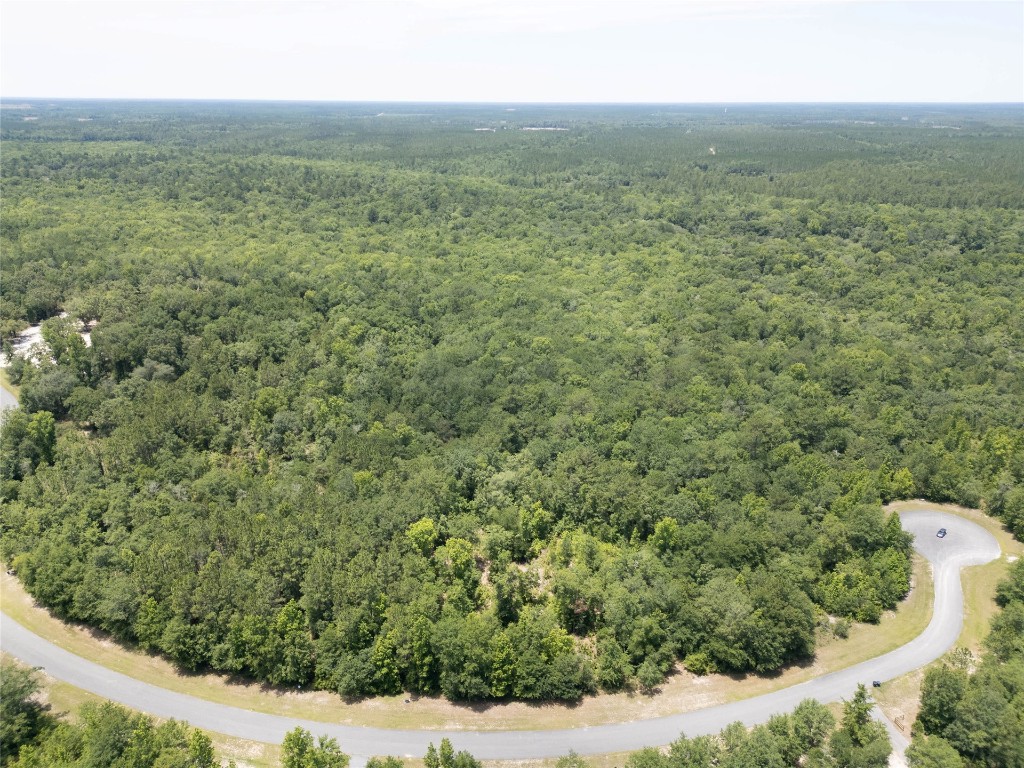 a view of a field with an ocean view