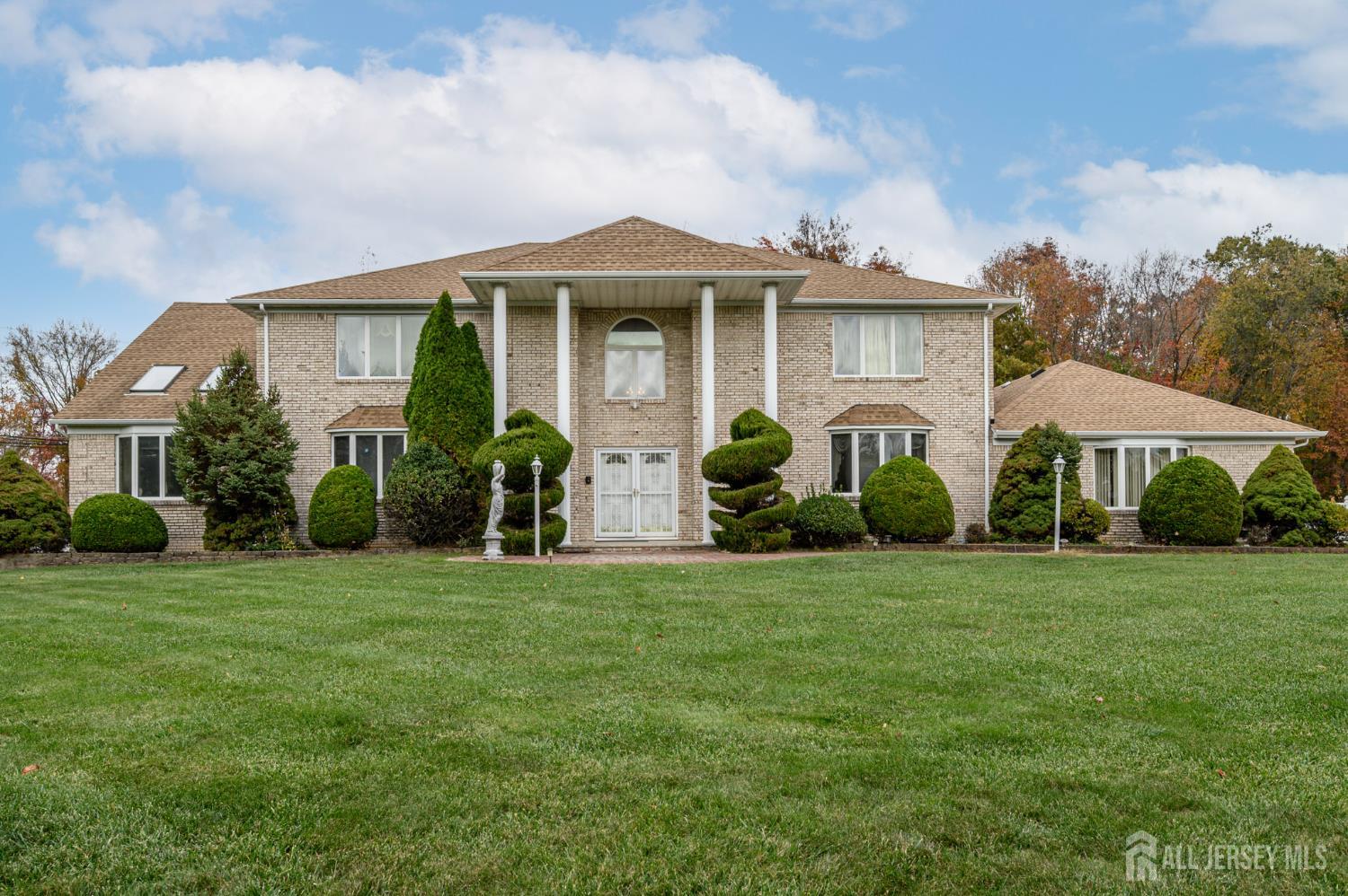 a front view of a house with a yard and porch