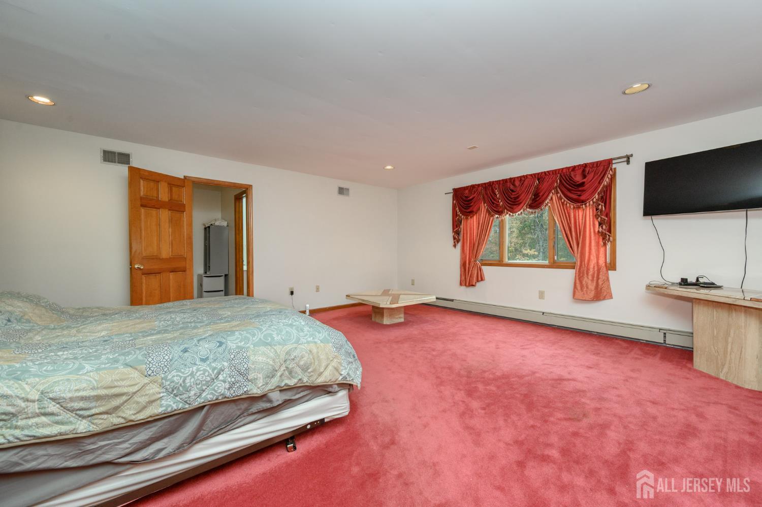 4 Drinking Brook Road Monmouth Junction, NJ 08852 - Photo 22 of 70 a bedroom with a bed and a flat screen tv