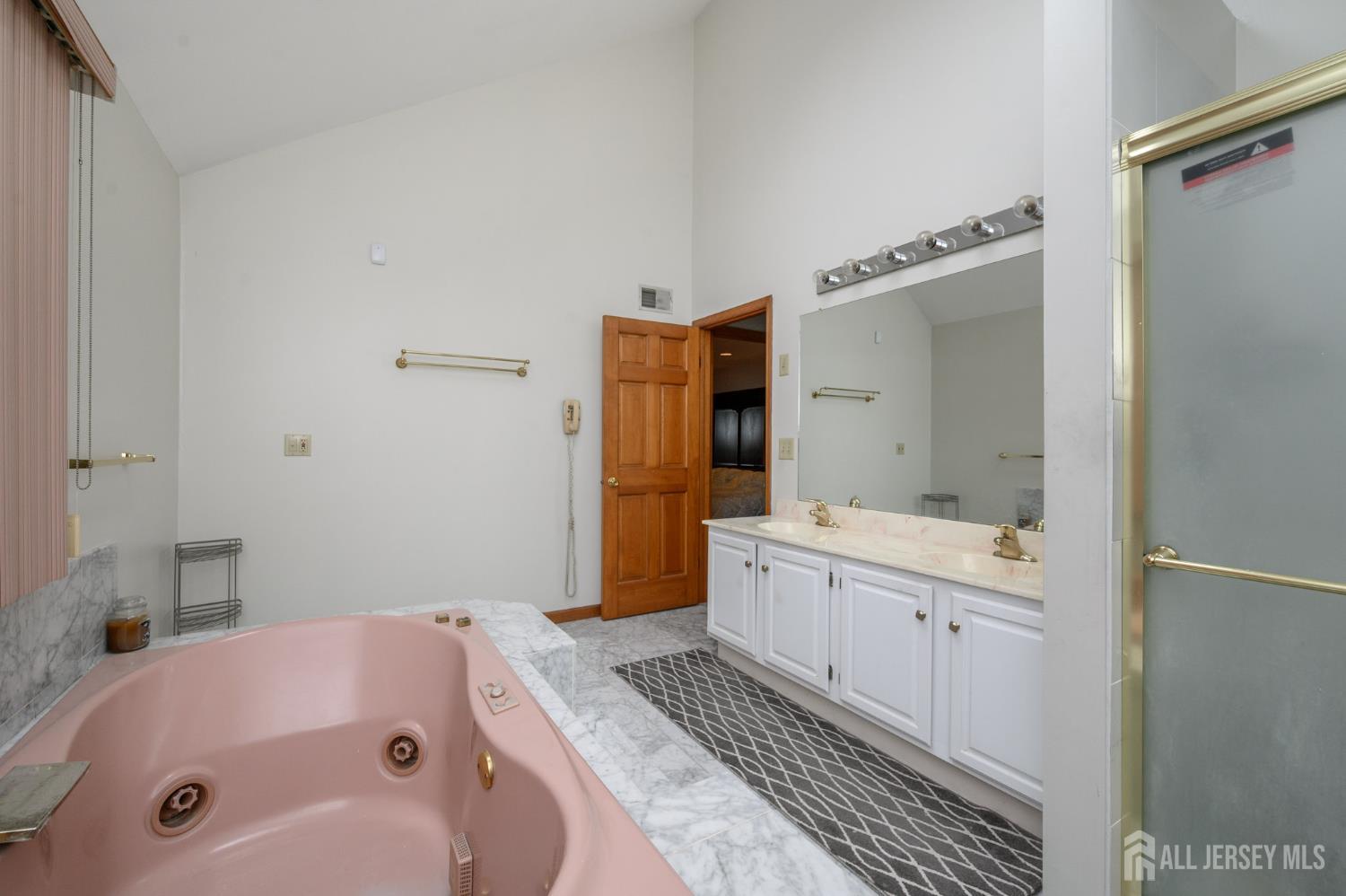 4 Drinking Brook Road Monmouth Junction, NJ 08852 - Photo 27 of 70 a bathroom with a tub sink and mirror