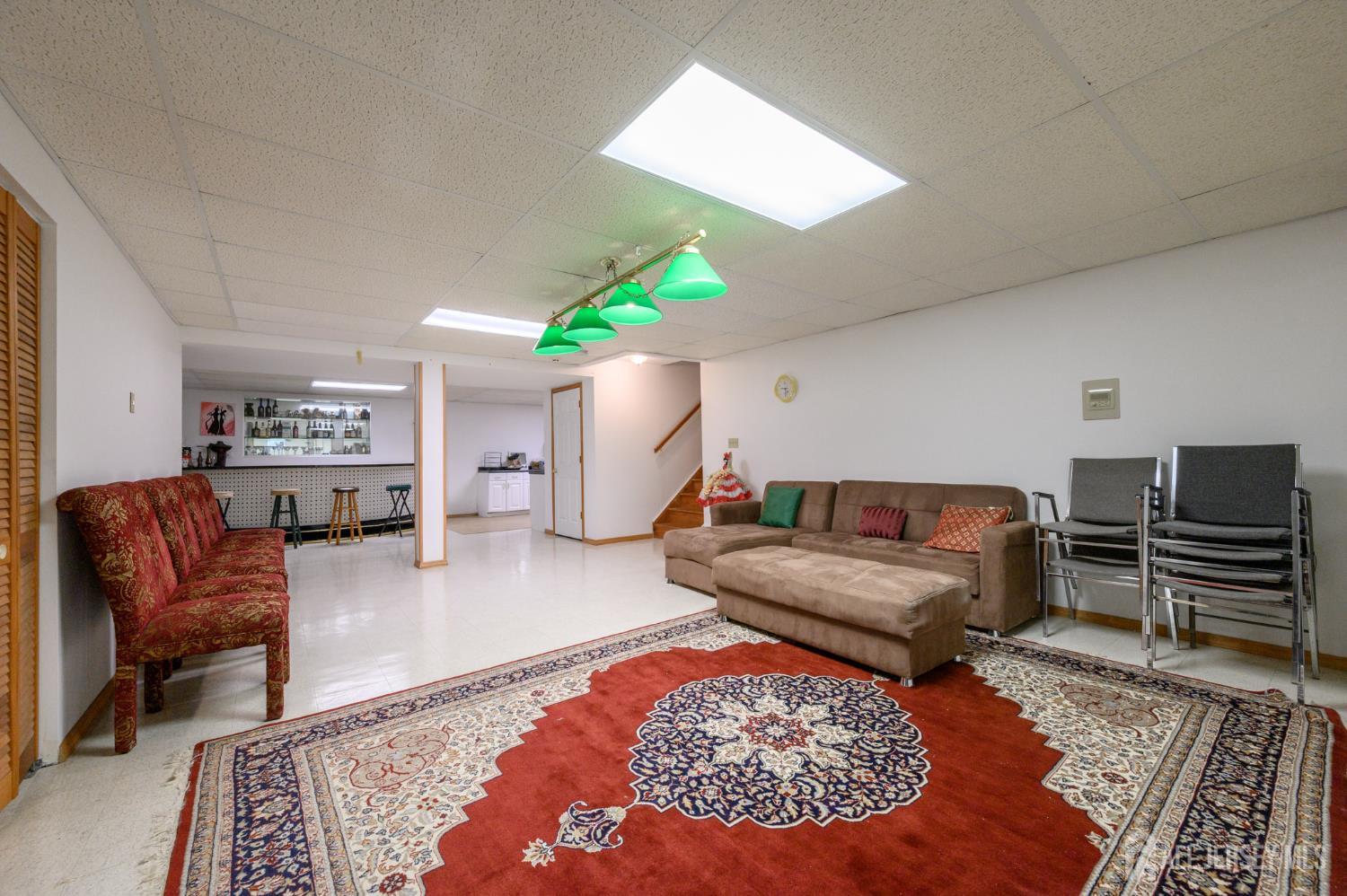 4 Drinking Brook Road Monmouth Junction, NJ 08852 - Photo 48 of 70 a living room with furniture and a rug