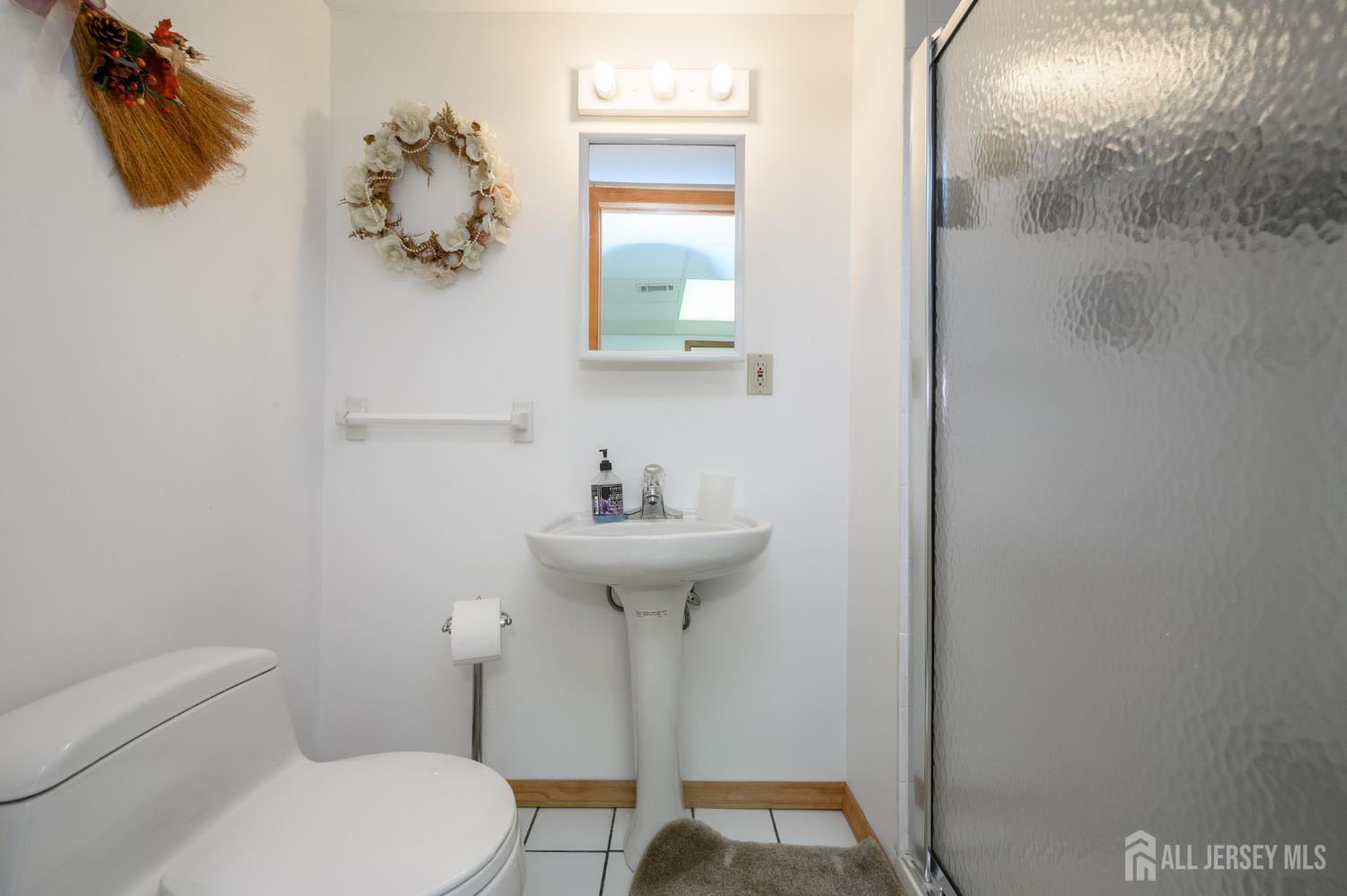 4 Drinking Brook Road Monmouth Junction, NJ 08852 - Photo 54 of 70 a bathroom with a sink toilet and a mirror