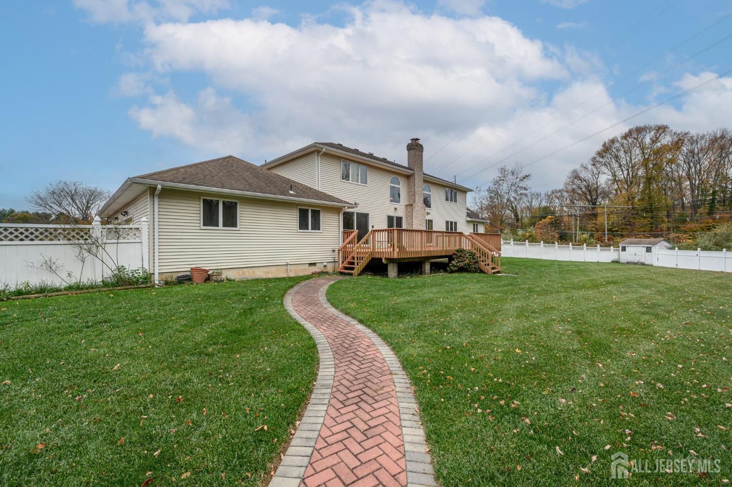 4 Drinking Brook Road Monmouth Junction, NJ 08852 - Photo 57 of 70 a front view of a house with a garden and yard