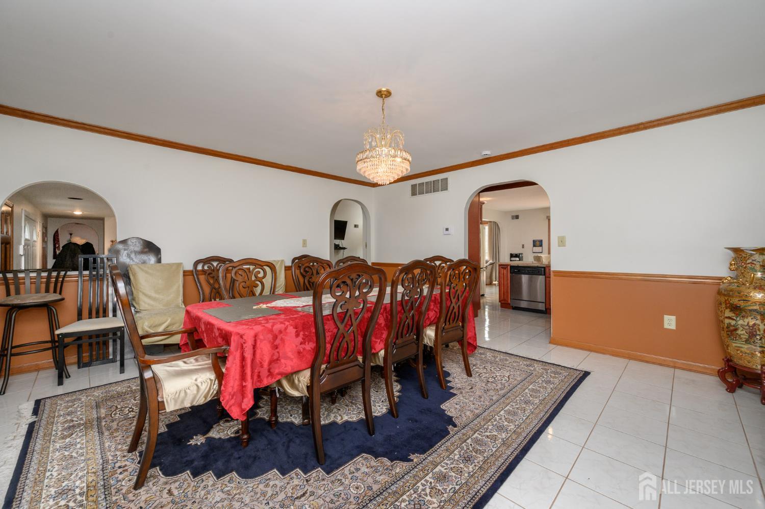 4 Drinking Brook Road Monmouth Junction, NJ 08852 - Photo 6 of 70 a living room with furniture a chandelier and a rug
