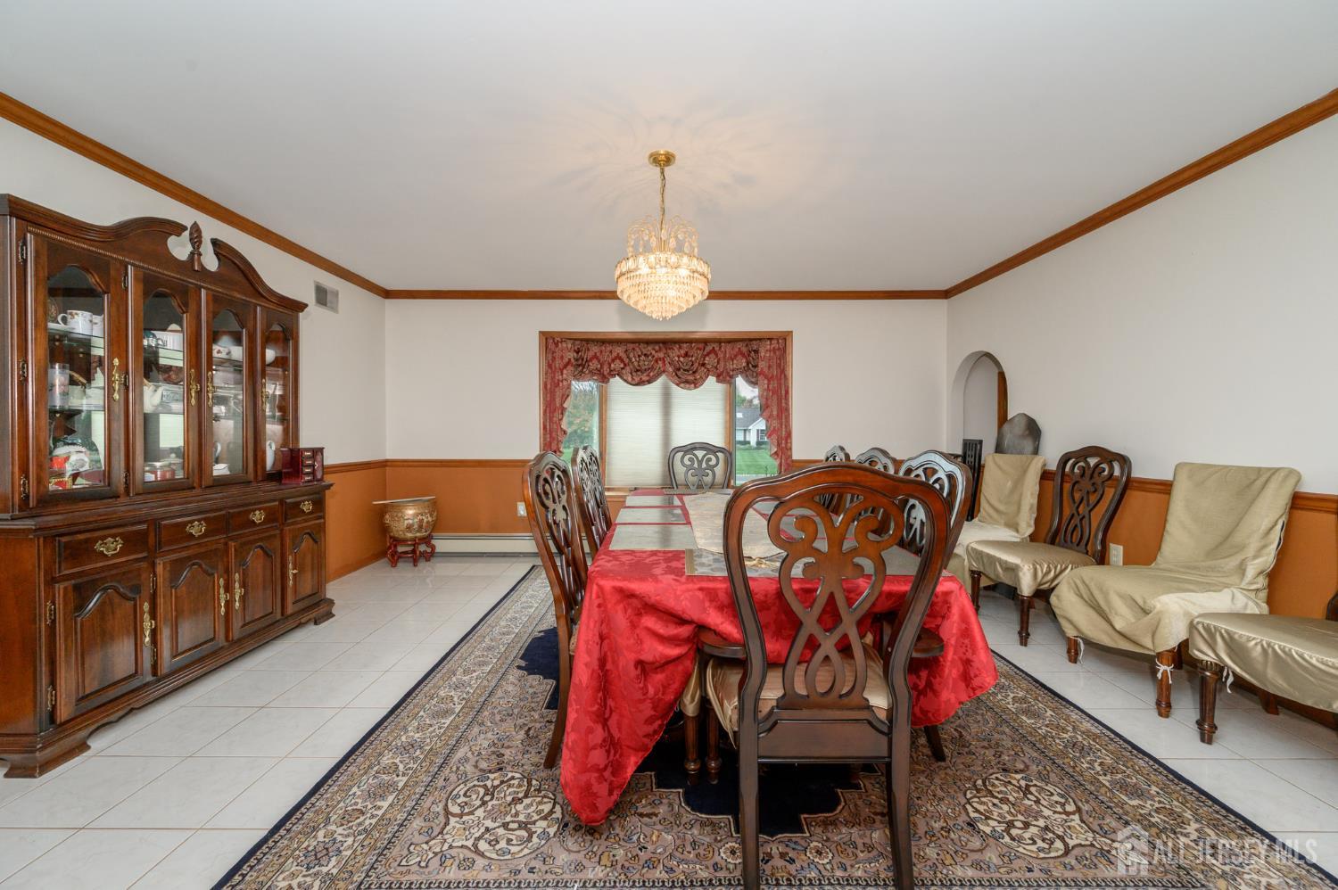 4 Drinking Brook Road Monmouth Junction, NJ 08852 - Photo 7 of 70 a living room with furniture a rug and a chandelier