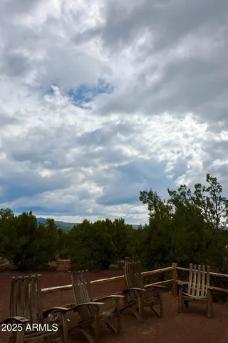 a view of city from balcony with seating space