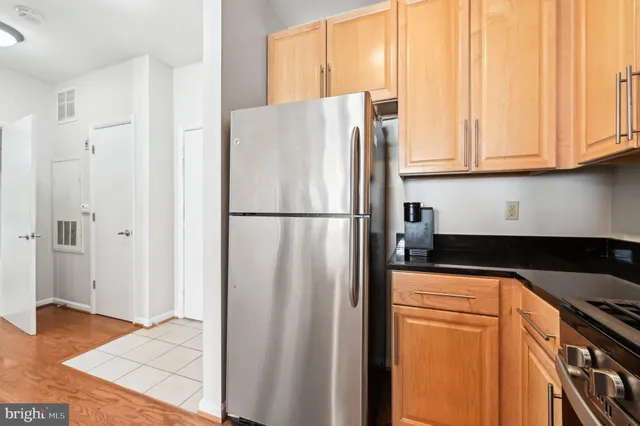 a white refrigerator freezer sitting in a kitchen