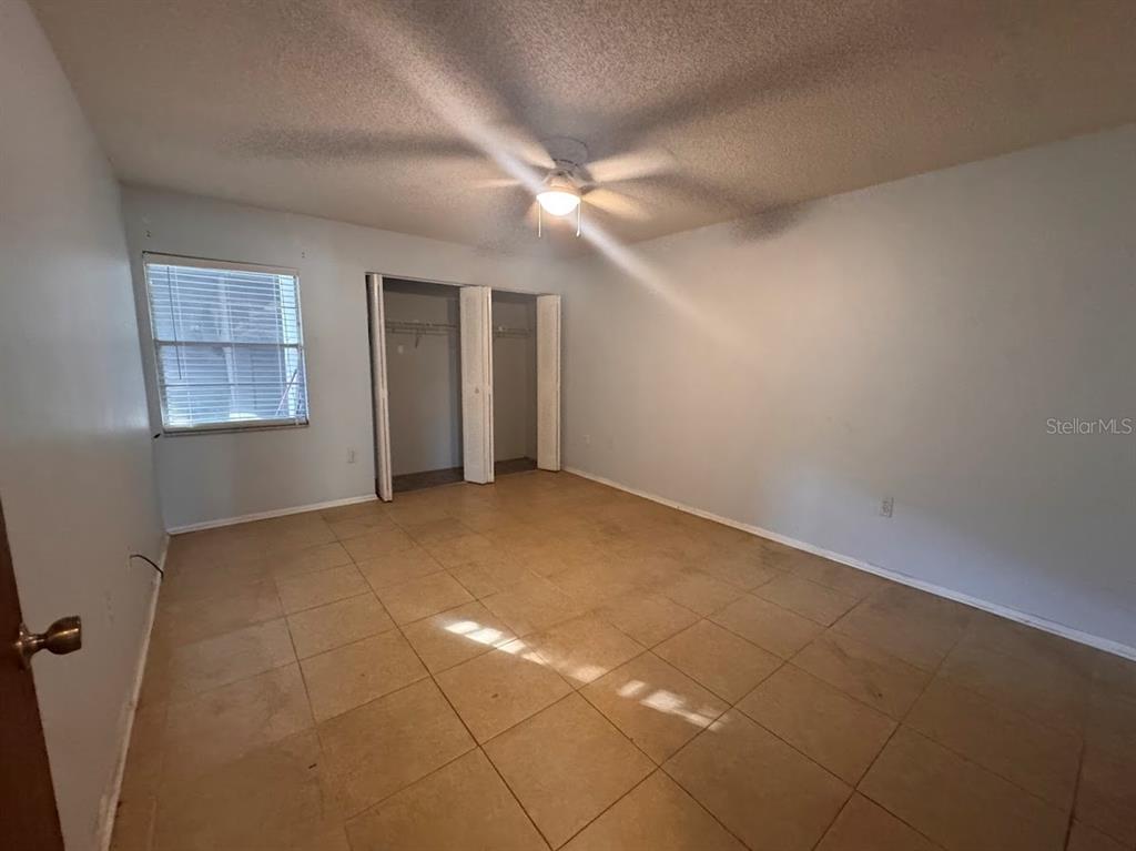 670 Green Valley Road, Unit F9 Palm Harbor, FL 34683 - Photo 11 of 22 a view of an empty room with a window