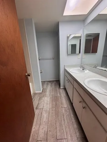 a bathroom with a sink a mirror and a toilet