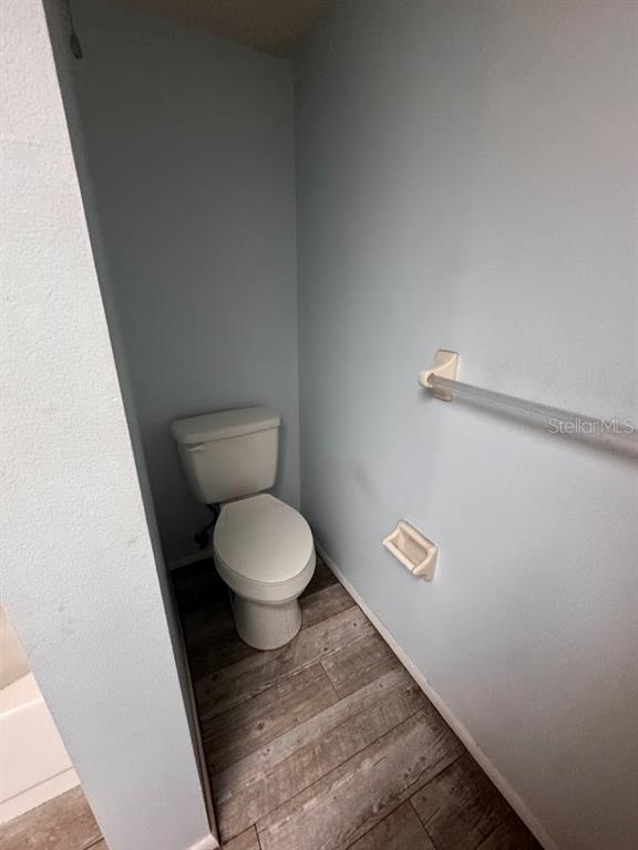 670 Green Valley Road, Unit F9 Palm Harbor, FL 34683 - Photo 14 of 22 a bathroom with a toilet and a shower