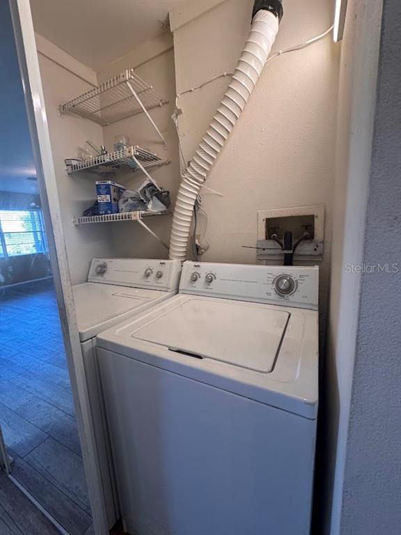 670 Green Valley Road, Unit F9 Palm Harbor, FL 34683 - Photo 20 of 22 a utility room with dryer and washer