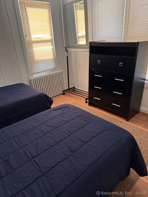 2144 Fairfield Beach Road Fairfield, CT 06824 - Photo 13 of 32 a bedroom with a bed and a window